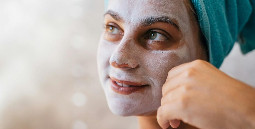 close up photo of a woman with facial mask