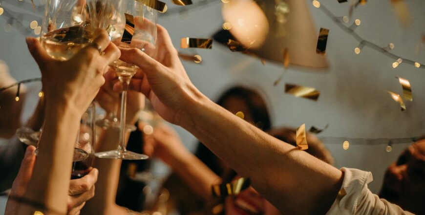 people toasting wine glasses
